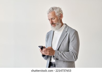 Older mature adult business man, senior middle aged old businessman professional wearing suit holding cell phone using smartphone mobile app online standing isolated on white background.