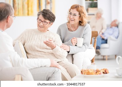 Older Men And Women Spending Time Together In A Rest Home