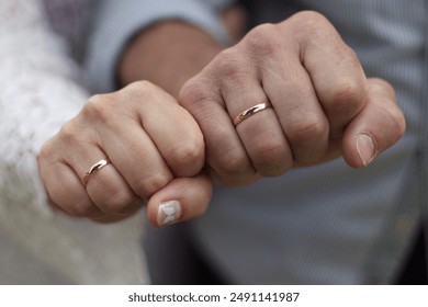 And older newlywed couple showing their wedding rings on their right hand - Powered by Shutterstock