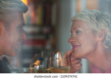 Older Romantic Couple Drinking White Wine