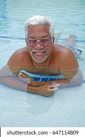 Older Senior Man Relaxes In The Pool