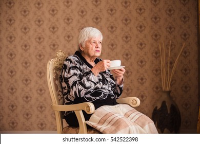 Older Single Disabled Woman Drinking Tea