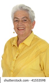 An Older Smiling Woman In A Yellow Shirt Over White Background