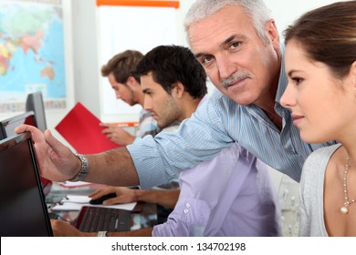 Older Students Using Computers In The Classroom