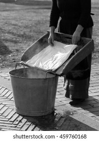 Older Woman Does The Laundry In An Old Tub