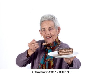 Older Woman Eating A Piece Of Cake