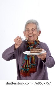 Older Woman Eating A Piece Of Cake