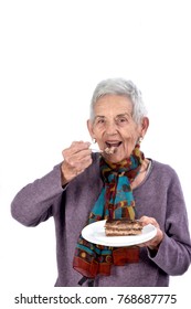 Older Woman Eating A Piece Of Cake