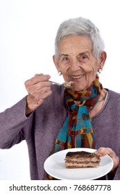 Older Woman Eating A Piece Of Cake