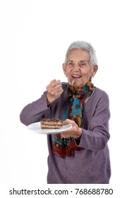 Older Woman Eating A Piece Of Cake