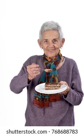 Older Woman Eating A Piece Of Cake