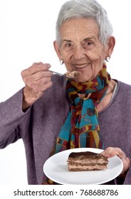 Older Woman Eating A Piece Of Cake