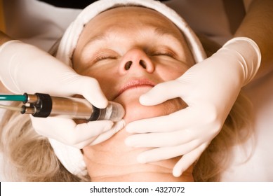 Older Woman Getting Electrolysis On He Face