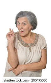 Older Woman Is Happily Surprised On White Background