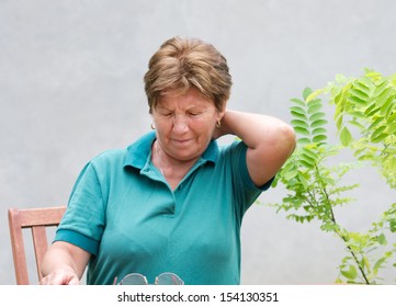 	Older Woman Has Neck Pain