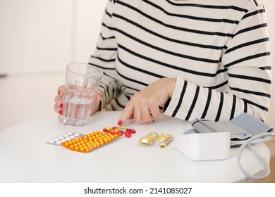 Older Woman Hold Glass Of Water And Antibiotic Aspirin Pill Feel Unhealthy At Home, Sick Mature Female Take Daily Dose Of Supplemolder Woman Hold Glass Of Water. Elderly Healthcare Concept