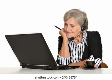 Older Woman With A Laptop On A White Background