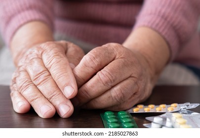 An Older Woman Old Lady Is Taking Medication. An Elderly Lady, A Tablet And A Glass Of Water In Her Hands. Poor Old People Expensive Pills