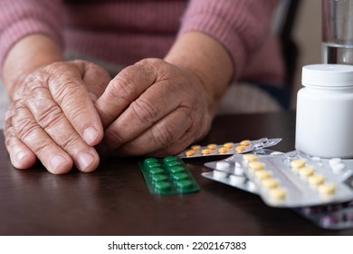 An Older Woman Old Lady Is Taking Medication. An Elderly Lady, A Tablet And A Glass Of Water In Her Hands. Poor Old People Expensive Pills