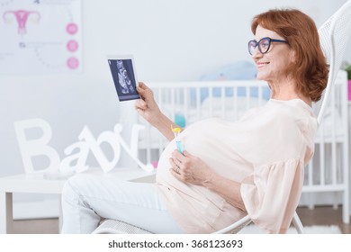 Older Woman In Pregnant Waiting For Baby