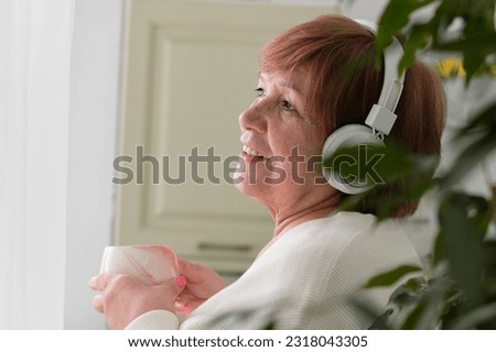 older woman with a serene expression gazes out of window, radiating a sense of grace and contentment that comes with embracing passage time and finding joy in every phase of life. the Golden Years