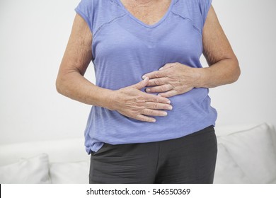 Older Woman With Stomach Ache, Pain Or Injury