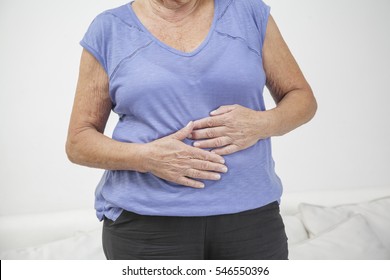 Older Woman With Stomach Ache, Pain Or Injury