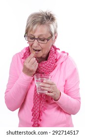 Older Woman Is Taking A Tablet Isolated