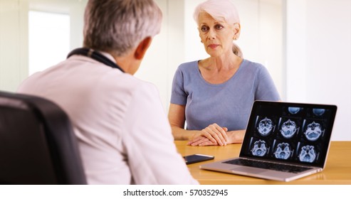 Older Woman Talking With Personal Doctor About Her Health Concerns