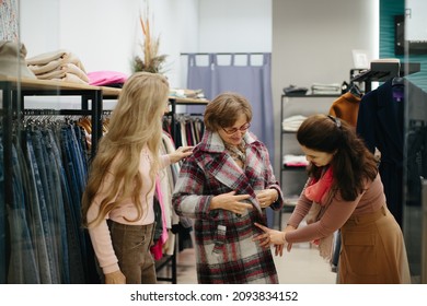 Older Woman Trying On Clothes In The Dressing Room Of A Clothing Store