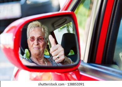 Older Woman Wearing A Seatbelt When In A Car.