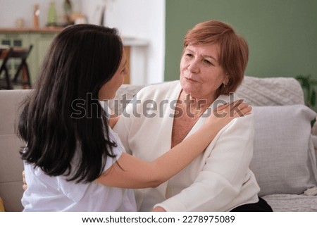 older woman who is clearly loved and appreciated by her daughter, challenging ageist stereotypes that older adults are no longer valuable members of society. aging as a natural and valuable part of