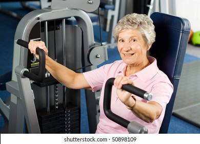 Older Woman Working Out At The Gym