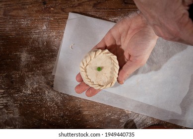 Older Woman And Young Woman Making Traditional Mallorcan Empanadas. Mallorcan Empanadas. Easter Traditions. Hands Doing Culinary Activities.