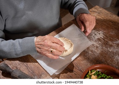 Older Woman And Young Woman Making Traditional Mallorcan Empanadas. Mallorcan Empanadas. Easter Traditions. Hands Doing Culinary Activities.