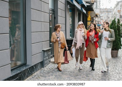 Older Women, Best Friends Have Fun Walking The Streets Of The City Shopping.