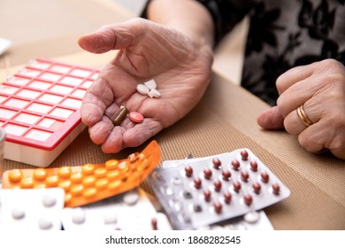 Older Women Taking Medications At Table, Senior Woman Preparing Pills , Prepare Daily Medicine Tablet In Pillbox