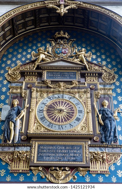 Oldest Public Clock in Paris France. Built in the 14\
c. by Henri le Vic, a German engineer. Translation, This machine,\
which so justly divides hours, teaches us to support justice and\
protect laws