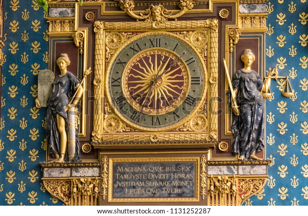 Oldest Public Clock in Paris France.Built in the 14\
century by Henri le Vic, a German engineer. Translation, This\
machine, which so justly divides hours, teaches us to support\
justice and protect laws