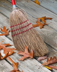 Old-fashioned Jackstraw Broom Head  Surrounded By Oak Leafs.
