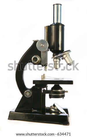An old-fashioned microscope, of the type used in scientific or medical research in the latter part of the 20th Century.