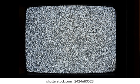 An old-fashioned television set emitting a screen full of black and white static noise, no signal, live interruption, simple abstract spooky scary horror background nobody, no people, end of broadcast - Powered by Shutterstock