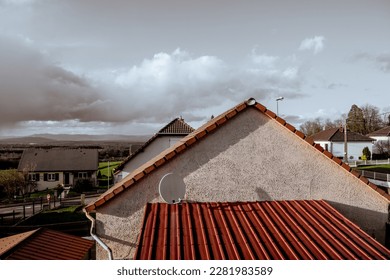 an old-style rooftop under white clouds - Shutterstock ID 2281983589