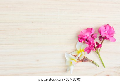 Oleander and Plumeria on wooden  , Top view of flowers on wooden table