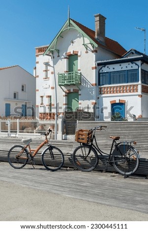 Oleron island in Charente-Maritime, France. Bicycles on the seafront promenade of the small seaside resort of Saint-Trojan-les-Bains