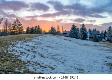 Oleskiw Park, Edmonton, Alberta, Canada Sunnset In Early Spring With Dormant Grass And Melting Snow.