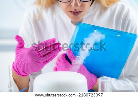 Olfactory Lab Scientist Taking Notes during Aroma Essential Oil Test