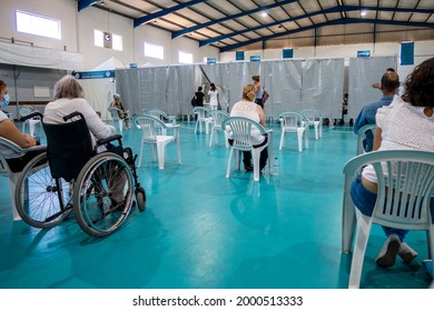 Olhao, Portugal - June 30, 2021: People Waiting In The Waiting Room Before Getting Covid 19 Vaccine In Vaccination Center