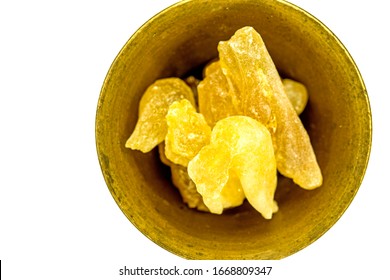 Olibanum in a mortar, cut out on a white background