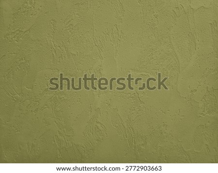 Olive decorative plaster wall texture skip trowel, marmorino like finish. Textured stucco wall background with decorative relief pattern